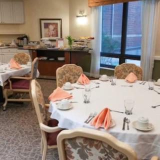 A elegantly set dining table with folded napkins in a formal restaurant setting.