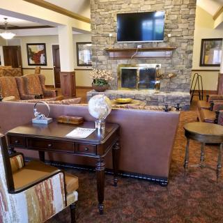 Cozy lounge area with a fireplace and comfortable seating.
