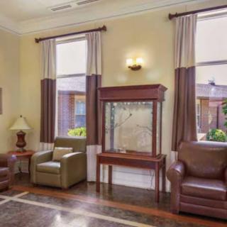 A cozy living room setup featuring comfortable seating and elegant decor.