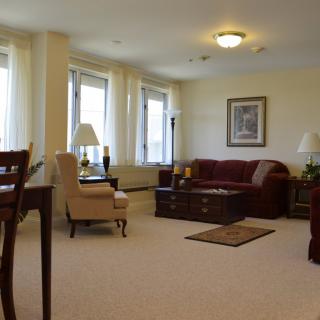 A cozy living room with comfortable furniture and natural lighting.