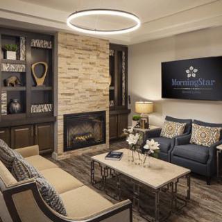 A modern living room featuring a cozy seating area with a fireplace, sleek furniture, and contemporary decor.