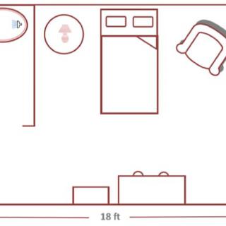 Simple floor plan of a bedroom with furniture placement.