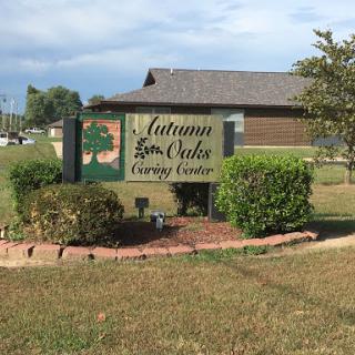 A welcoming sign for the community center, surrounded by well-maintained landscaping.
