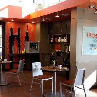 A modern caf interior featuring sleek furniture and a vibrant color scheme.