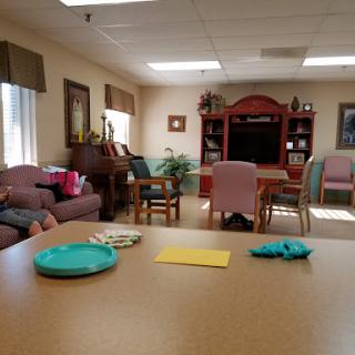 A cozy lounge area designed for relaxation and socialization in a senior living community.