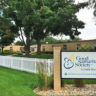 Exterior view of the Good Samaritan Society with a sign and well-maintained lawn.