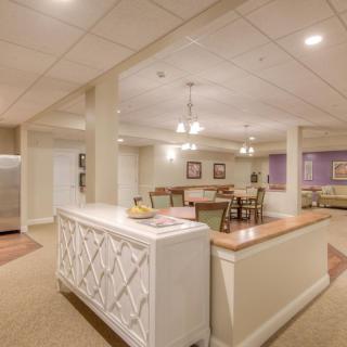 Basement area with a kitchenette and dining setup.
