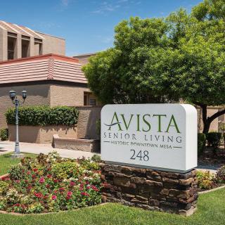 Avista Senior Living building with a sign and landscaped surroundings.