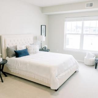 A bright and airy modern bedroom with minimalist decor.