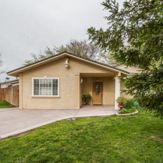 A suburban house with a well-maintained front yard and driveway.
