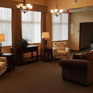A cozy living room with comfortable seating and warm lighting.
