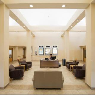 A modern lobby with comfortable seating and natural lighting.