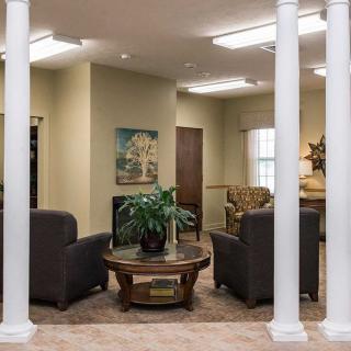 A cozy waiting area with comfortable seating and decor.