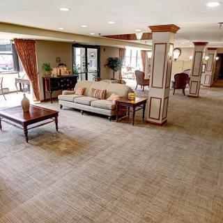 A spacious and elegantly designed lobby with comfortable seating and tasteful decor.