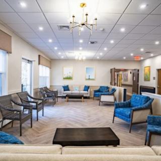 A modern waiting room with ample seating and stylish decor.