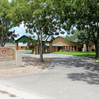 A welcoming educational facility surrounded by lush greenery.