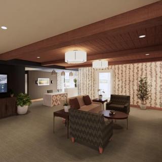 A modern living room interior with stylish furniture and decor, featuring an open space layout.