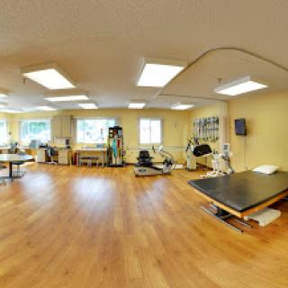 A well-equipped physical therapy room designed for rehabilitation and exercise.