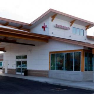 The exterior of an urgent care medical facility with a modern architectural design.