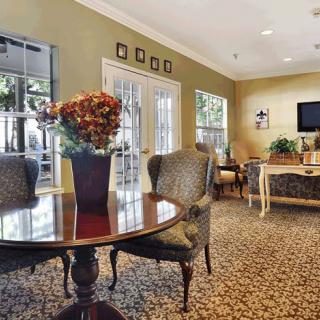 A cozy living room with elegant furniture and decor.