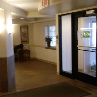 A view of the lobby entrance with a seating area and natural light.