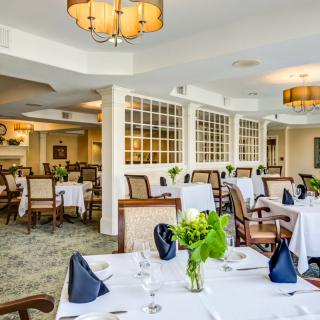 Elegant restaurant dining area with neatly set tables and stylish decor.