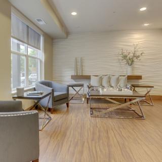 A modern living room with contemporary furniture and neutral tones.