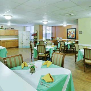 A well-arranged dining room with tables set for a meal.