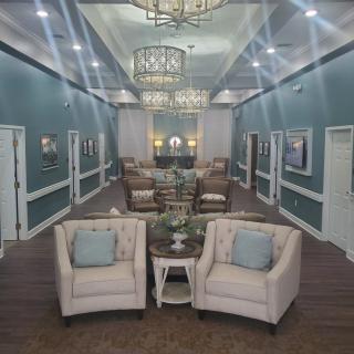 A modern lounge area with elegant furniture and ambient lighting.