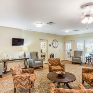 A cozy living room with comfortable seating and a television.