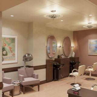A cozy salon interior featuring chairs, mirrors, and wall artwork.