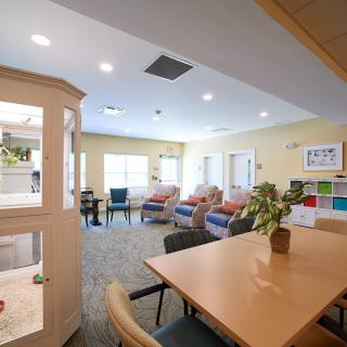 A bright and cozy living area with comfortable seating and a dining table.