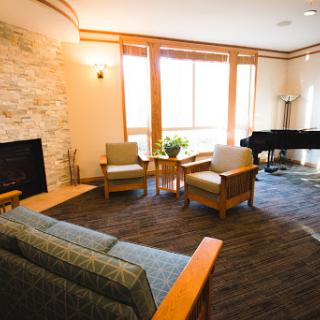 A cozy and inviting living room with ample natural light and stylish furnishings.