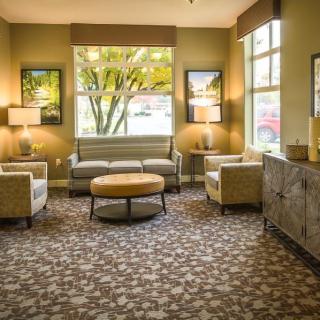 A cozy living room with stylish furniture and warm lighting.