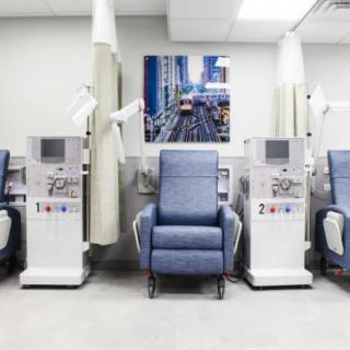 A hospital room equipped with dialysis machines and reclining chairs for patient treatment.