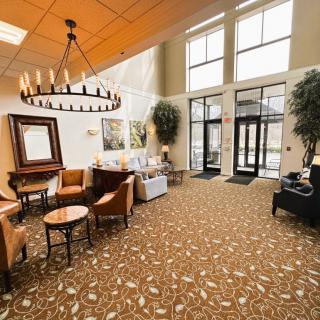 A spacious lobby with elegant decor and comfortable seating.