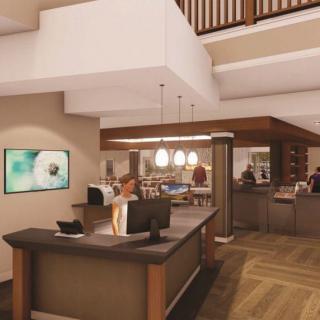 Modern lobby reception area with elegant interior design and lighting.