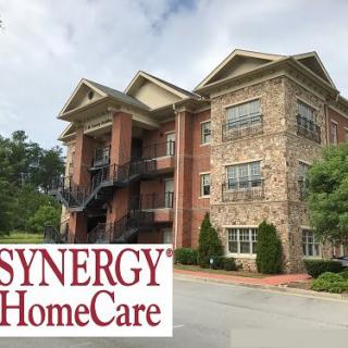 An office building with Synergy HomeCare branding in front.