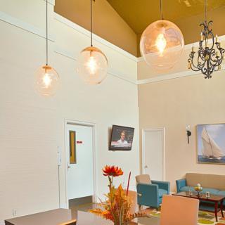 A modern living room with stylish lighting and contemporary furnishings.