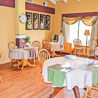An inviting restaurant dining area with neatly arranged tables and chairs.