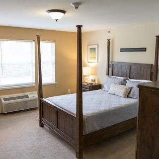 A cozy bedroom with a four-poster bed and stylish decor.