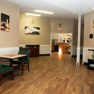 A view of the restaurant's interior featuring tables and chairs in a casual dining setting.
