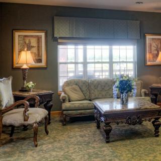 A cozy living room with elegant furniture and soft lighting.