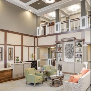 A spacious and modern lobby with comfortable seating and elegant decor.