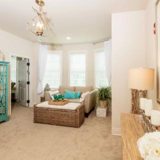 A bright and cozy living room with modern furnishings and abundant natural light.