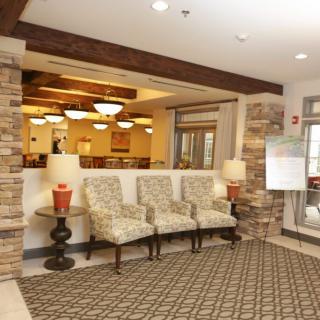 A welcoming lobby area with seating and warm lighting.