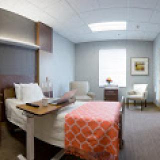 A bright and comfortable hospital room designed for patient care.