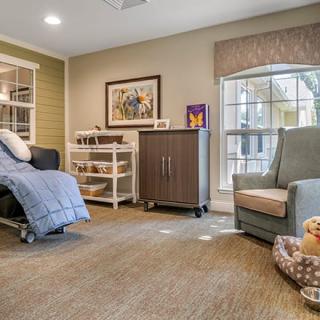 A cozy living room with comfortable seating and natural light.