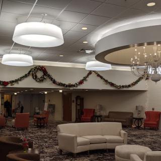 A beautifully decorated lobby featuring modern seating and festive holiday decorations.