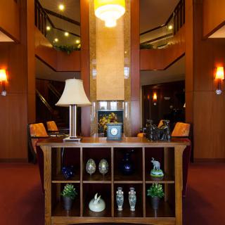 A welcoming hotel lobby featuring elegant decor and comfortable seating.